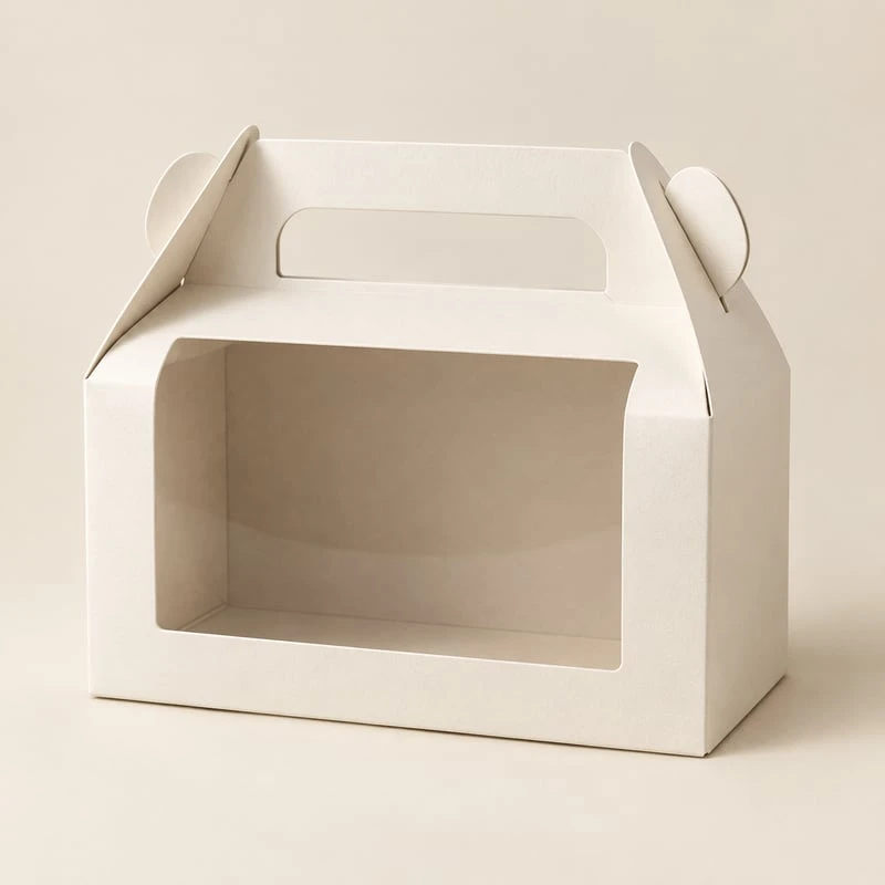 Folding packaging box with an integrated carry handle