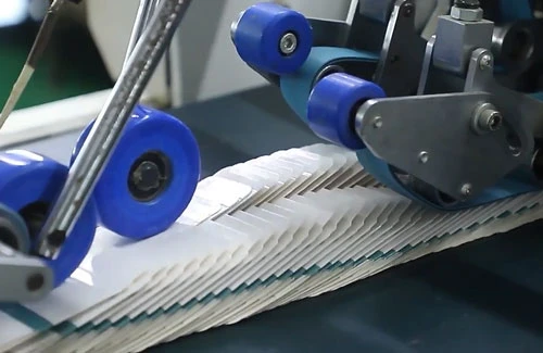 Packaging components moving through forming machinery