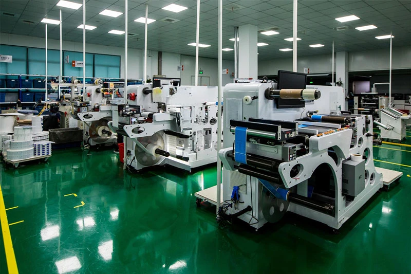 XGolden packaging production machinery in a clean factory workshop